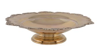 A silver gilt shaped circular fruit stand by Mappin & Webb, Sheffield 1961, with a shell and scroll
