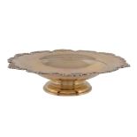 A silver gilt shaped circular fruit stand by Mappin & Webb, Sheffield 1961, with a shell and scroll