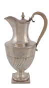 A George III silver vase shape hotwater pot by Joseph Cooper, London 1802, with a turned finial to