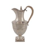 A George III silver vase shape hotwater pot by Joseph Cooper, London 1802, with a turned finial to