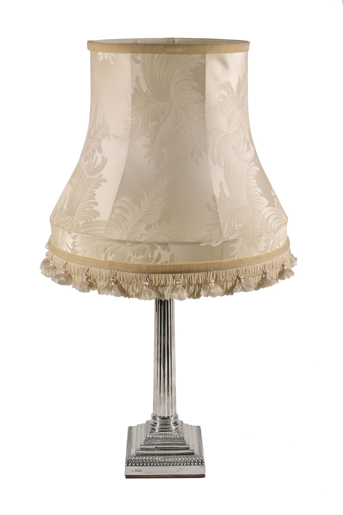 A silver Corinthian column table lamp by Hawksworth, Eyre & Co. Ltd, Sheffield 1912, on a stepped