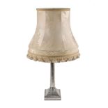 A silver Corinthian column table lamp by Hawksworth, Eyre & Co. Ltd, Sheffield 1912, on a stepped