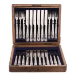 A set of twelve late Victorian silver dessert knives and forks by The Goldsmiths & Silversmiths Co.