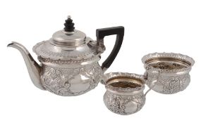 A late Victorian embossed batchelor's three piece tea service by Josiah Williams & Co. (George