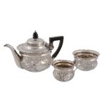 A late Victorian embossed batchelor's three piece tea service by Josiah Williams & Co. (George