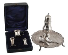 A collection of small silver, comprising: a George III fiddle pattern shell bowl caddy spoon by