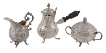 A matched German and Dutch silver three piece small coffee service, variously marked, circa 1900,
