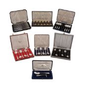 Five boxed silver flatware sets, comprising: six bean terminal coffee spoons; twelve silver gilt