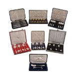 Five boxed silver flatware sets, comprising: six bean terminal coffee spoons; twelve silver gilt