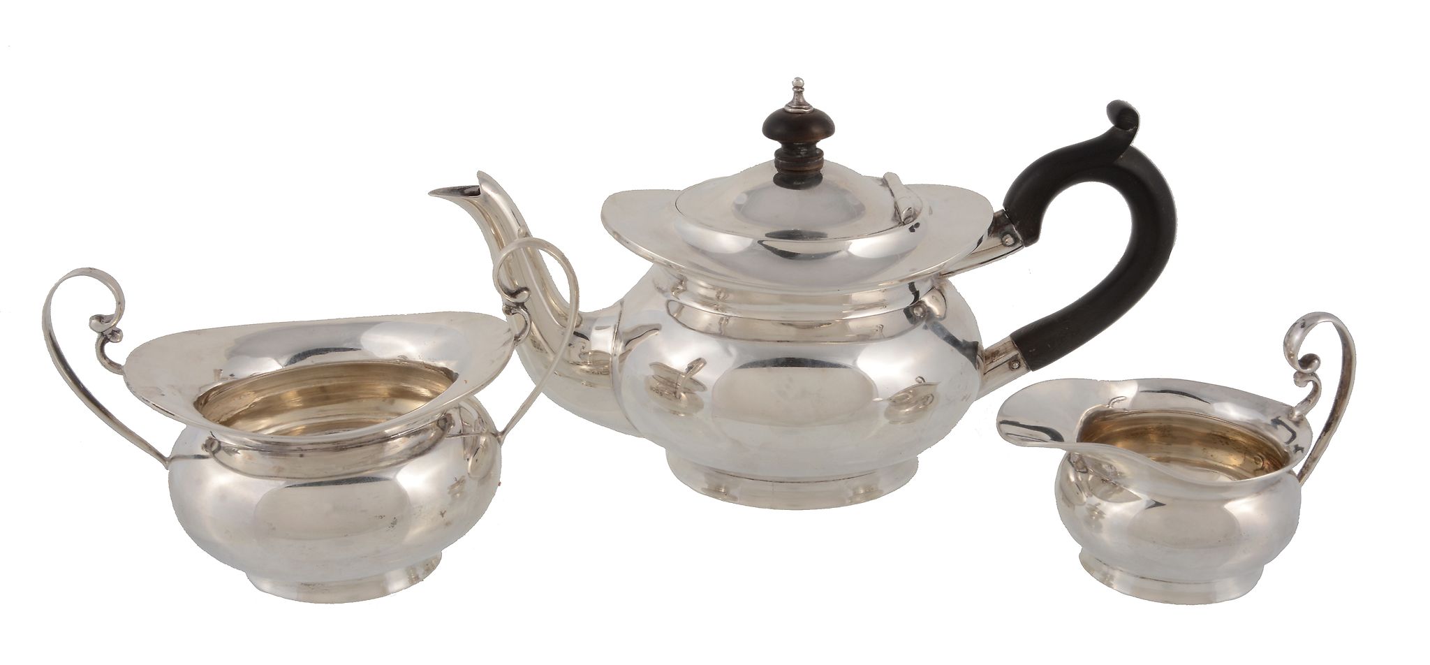 A matched Edwardian silver small three piece tea service by Edward Barnard & Sons, London 1902 &