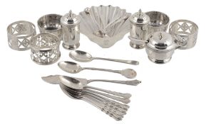 A silver five piece faceted circular condiment set by Adie Brother's Ltd., Birmingham 1924, the