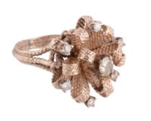 A diamond cluster ring, the textured ribbon bow design set with brilliant cut diamonds,
