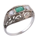 An emerald and diamond ring, the central rectangular shaped emerald in a collet setting between two