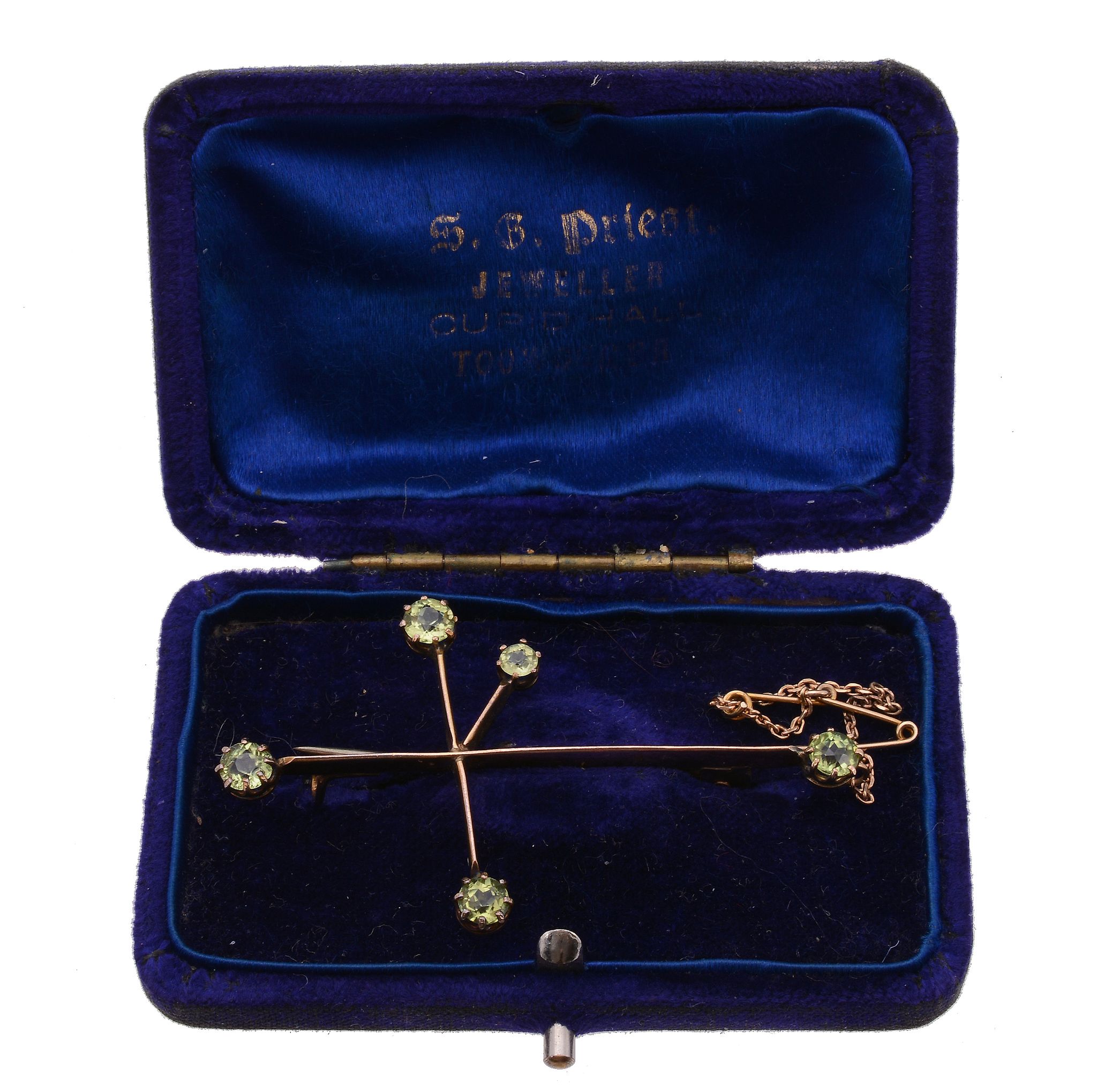 A Victorian Southern Cross brooch, set with circular shaped peridot to the terminals, stamped 9ct,