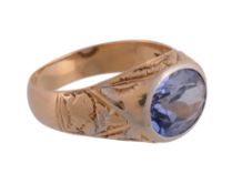 A synthetic sapphire single stone ring, the oval cut synthetic sapphire in a collet setting with