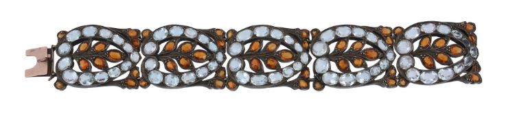 An aquamarine and spessartine garnet panel bracelet, the pierced stylised foliate panels set with