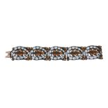 An aquamarine and spessartine garnet panel bracelet, the pierced stylised foliate panels set with