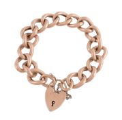 A 9 carat gold curb link bracelet, composed of polished curb links, to a 9 carat gold padlock
