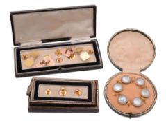 A collection of gentlmen's dress items, including: a mother of pearl and enamel shirt stud set, the