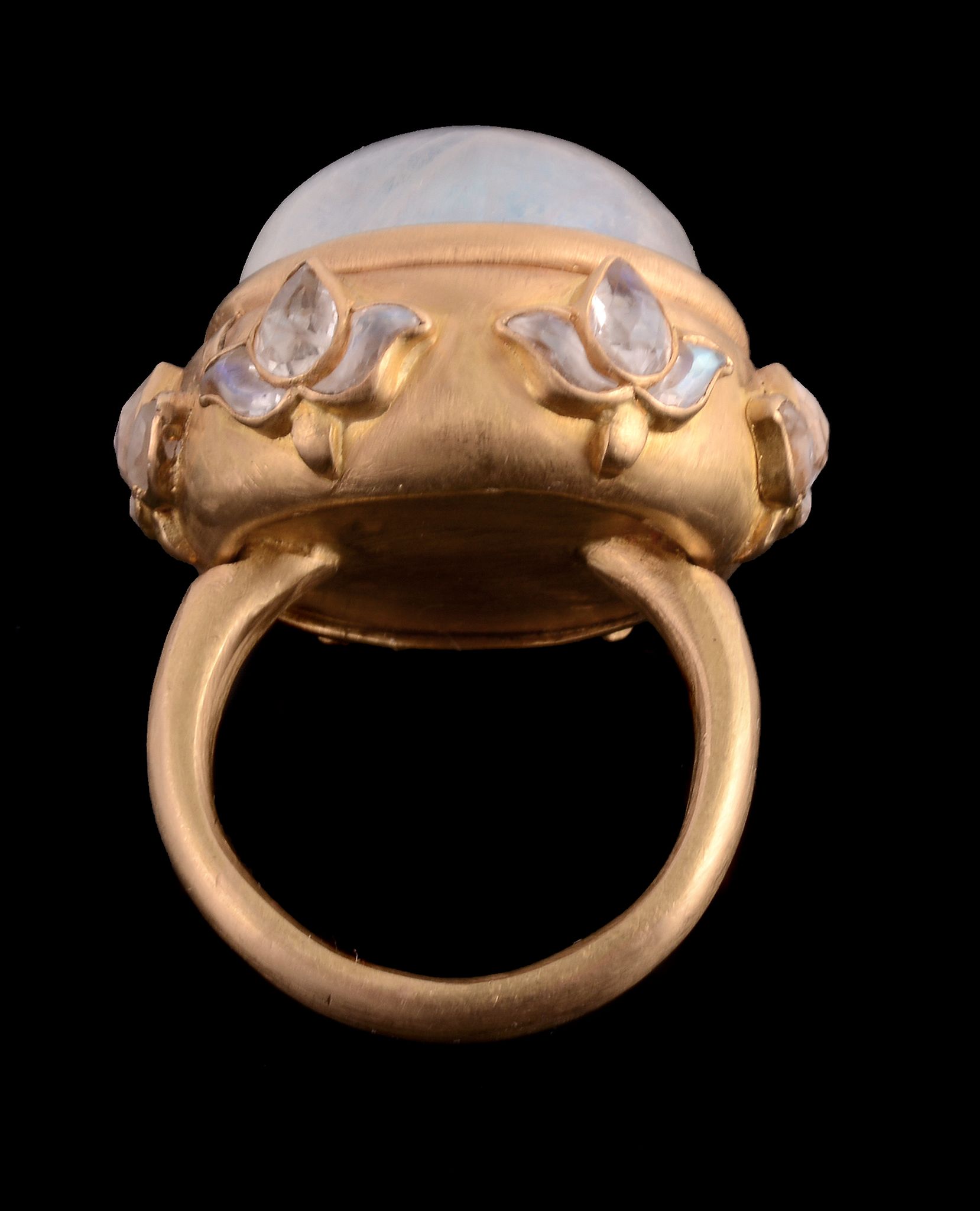 A moonstone ring, the circular shaped cabochon moonstone in a hinged collet setting opening to - Image 2 of 3