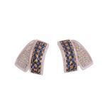 A pair of sapphire and diamond earrings, the overlapping panels set with brilliant cut diamonds and