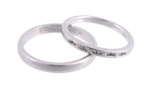 A platinum ring by Tiffany & Co., the plain band with an inner engraving, signed Tiffany & Co.