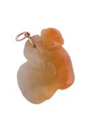 A jadeite jade monkey and gourd pendant, carved as a monkey clasping a gourd, with a pendant