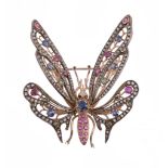 A gem set butterfly brooch, the body set with circular shaped rubies and a circular shaped