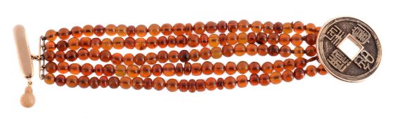 A five strand amber bracelet, composed of polished amber beads, to the circular shaped clasp with