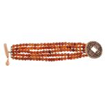 A five strand amber bracelet, composed of polished amber beads, to the circular shaped clasp with