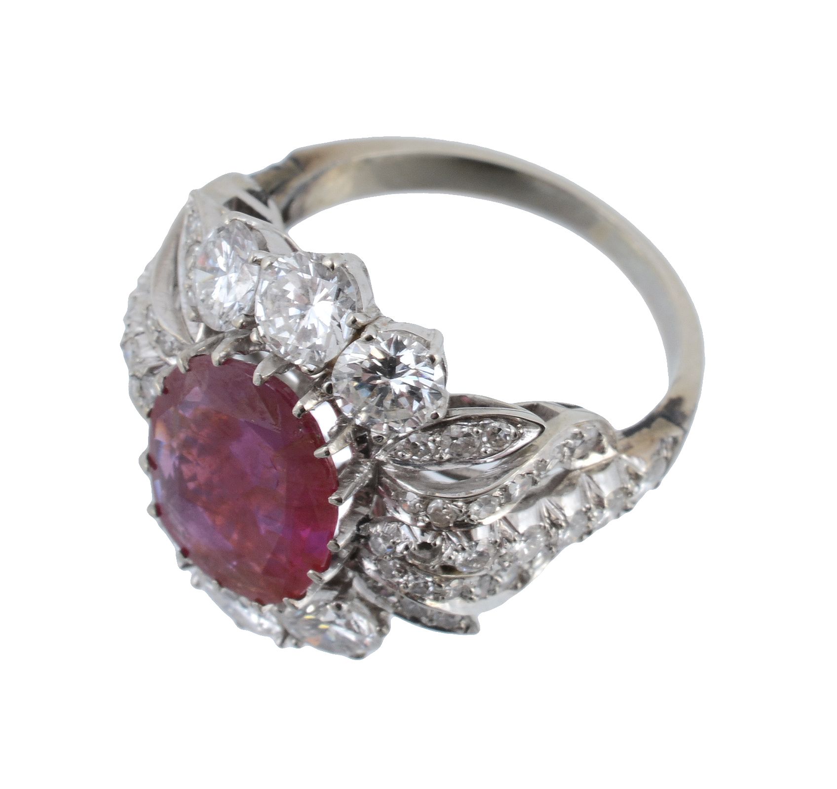 A ruby and diamond cluster dress ring, the central oval mixed cut ruby within a pierced brilliant - Image 3 of 3