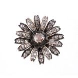 A diamond flower head brooch, the flower head set throughout with rose cut diamonds, 3.4cm long