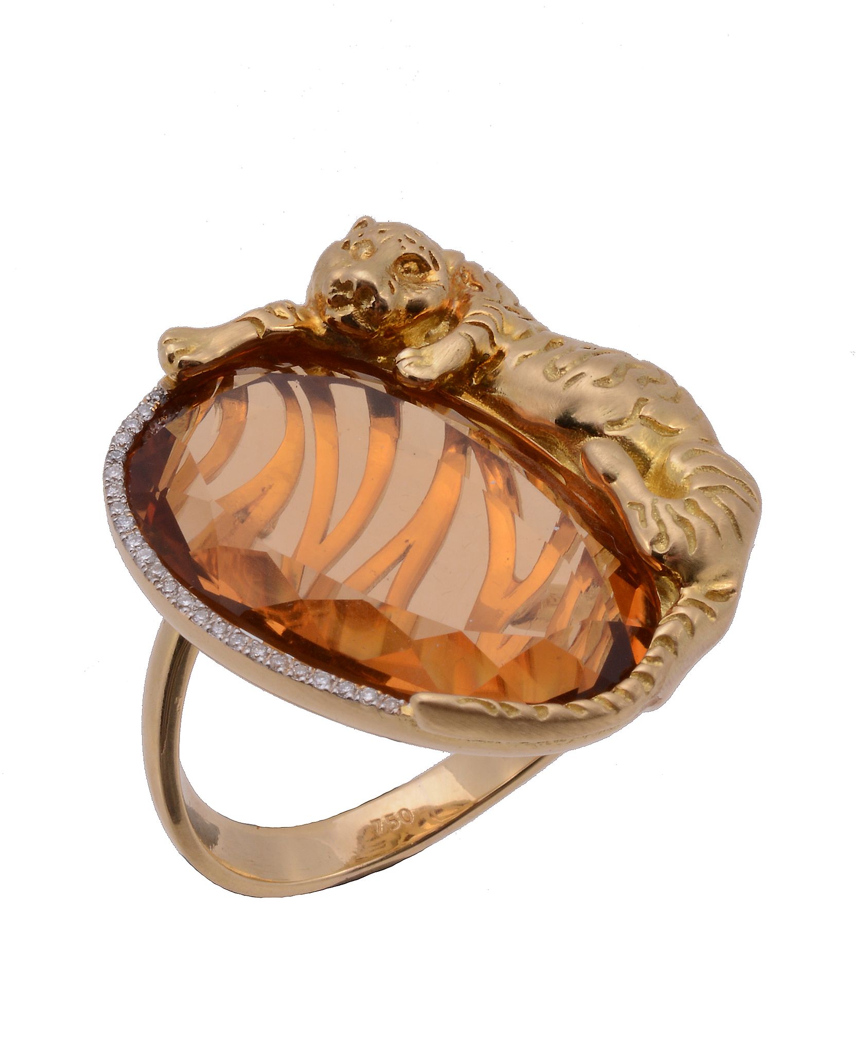 A citrine dress ring, the flattened oval shaped citrine with a recumbent tiger surmount, with