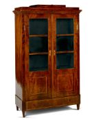 A Berlin Mahogany Armoire Germany circa 1825, having a stepped pediment inlaid with boxwood