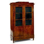 A Berlin Mahogany Armoire Germany circa 1825, having a stepped pediment inlaid with boxwood