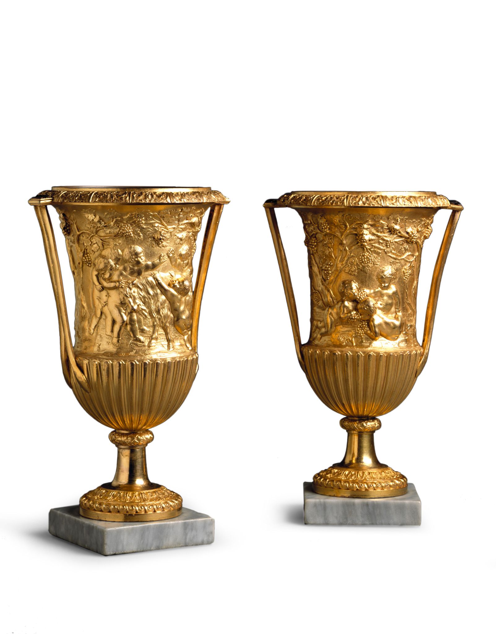 A Pair of Empire Gilt Bronze Vases Italy circa 1810, decorated in the round with Bacchic scenes