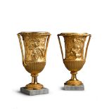 A Pair of Empire Gilt Bronze Vases Italy circa 1810, decorated in the round with Bacchic scenes