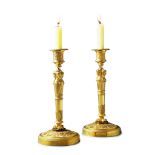 A Pair of Empire Gilt Bronze Candlesticks France circa 1810, the socles enriched with machined neo-