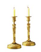 A Pair of Empire Gilt Bronze Candlesticks France circa 1810, the socles enriched with machined neo-