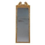 A Queen Anne Carved Giltwood Pier Glass England circa 1710, retaining the original plates, the lower
