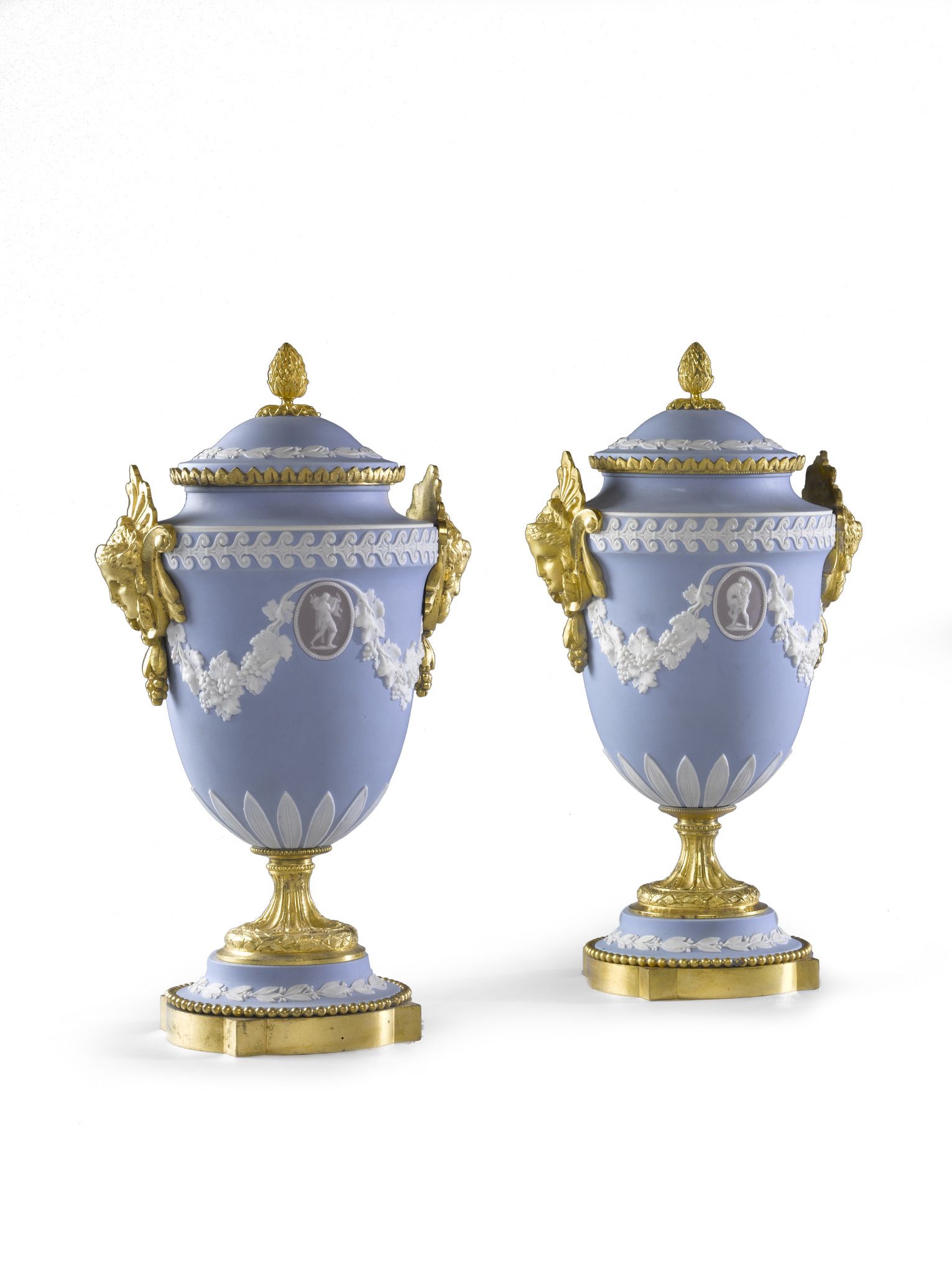 A Pair of Ormolu Wedgwood Vases England circa 1850, decorated in the traditional manner with white