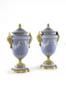 A Pair of Ormolu Wedgwood Vases England circa 1850, decorated in the traditional manner with white