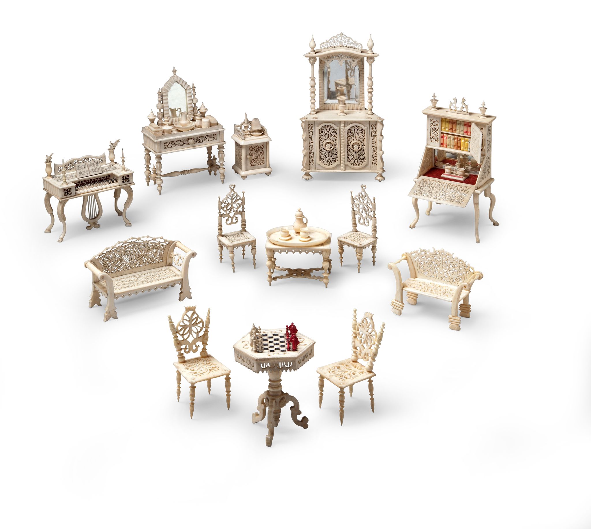 A Suite of Doll's House Furniture France circa 1890, carved in bone and consisting of a d r essing