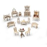 A Suite of Doll's House Furniture France circa 1890, carved in bone and consisting of a d r essing