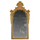 An Early 18th Century German Pier Mirror Germany circa 1710, the cresting modelled in the highly