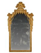 An Early 18th Century German Pier Mirror Germany circa 1710, the cresting modelled in the highly