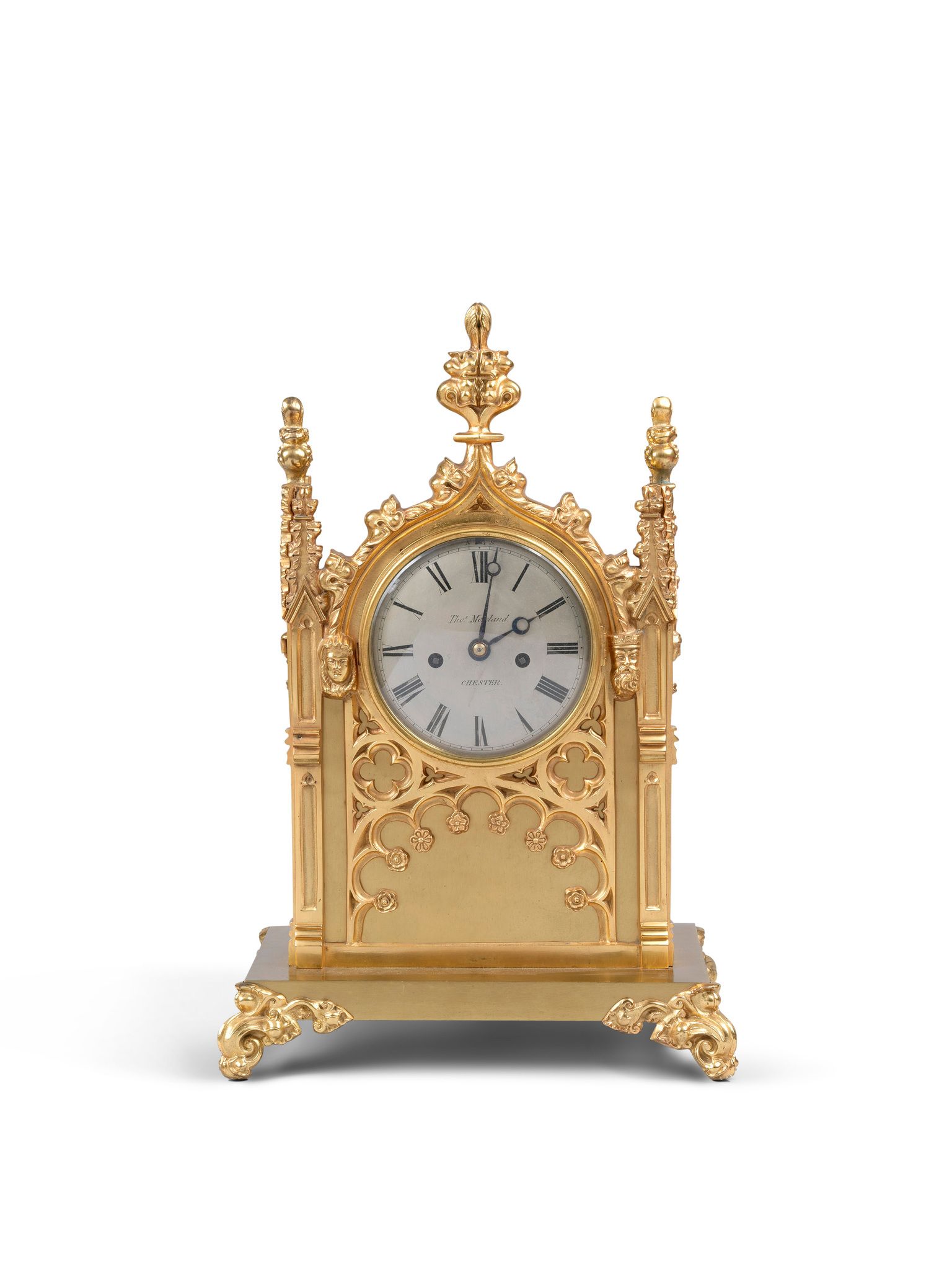 A Gothic Clock England circa 1860, signed Thos Moreland, Chester, the silvered face with Roman