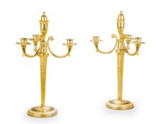 A Pair of Empire Gilt Bronze Candelabra France circa 1810, the central stem is decorated in low