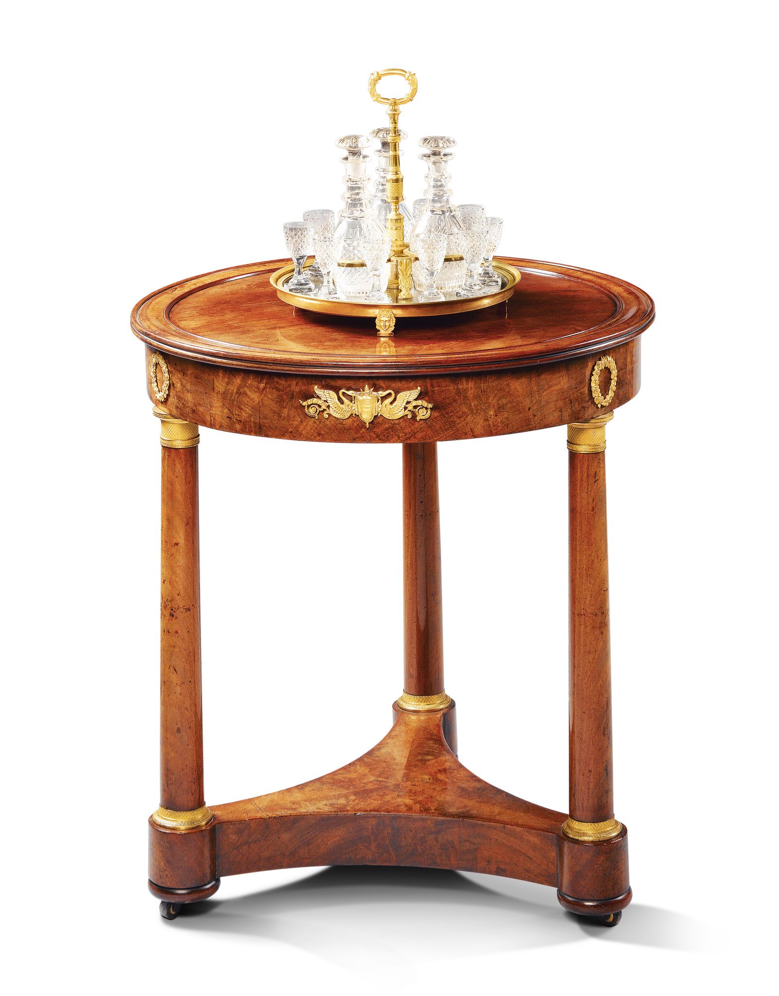 A Circular French Empire Mahogany Gueridon France circa 1820, the top of finely faded colour with