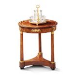 A Circular French Empire Mahogany Gueridon France circa 1820, the top of finely faded colour with
